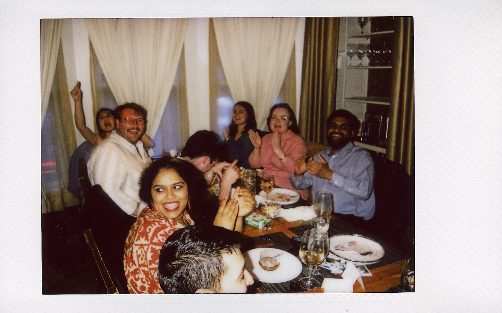 photograph of friends at dinner